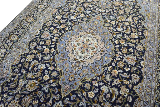 Backside of handmade 2000s Kashan rug showing knot structure and weave density