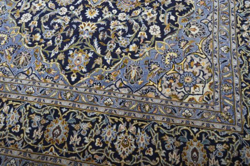 Close-up detail of 2000s Kashan rug from Iran / Persia showing Wool weave