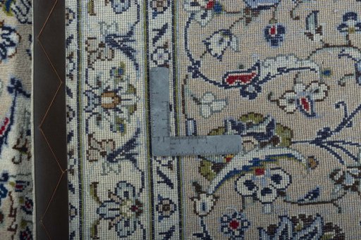 Backside of handmade 2000s Kashan rug showing knot structure and weave density