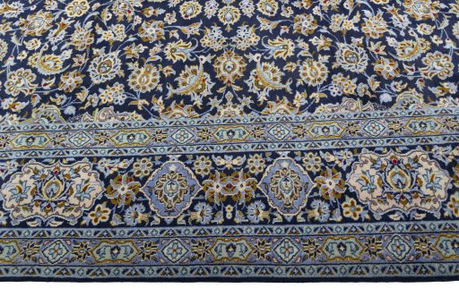 Corner detail of 1970s Kashan rug showing border pattern and Wool pile
