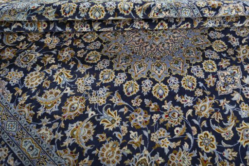 Close-up detail of 1970s Kashan rug from Iran / Persia showing Wool weave