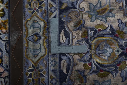 Backside of handmade 1970s Kashan rug showing knot structure and weave density