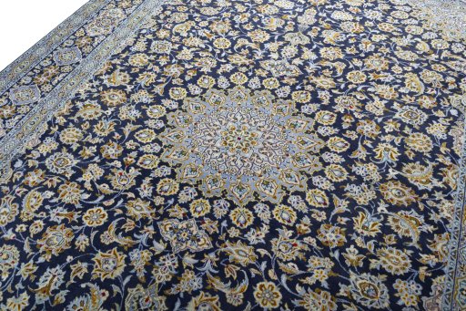Backside of handmade 1970s Kashan rug showing knot structure and weave density