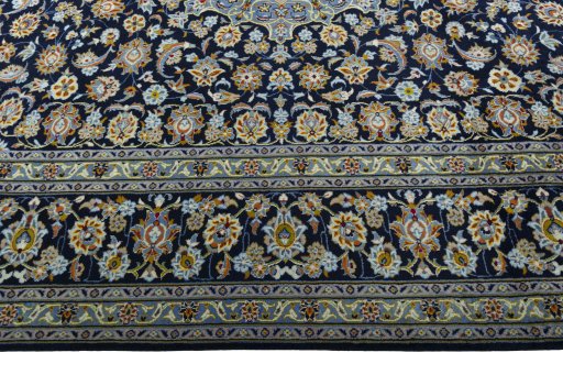 Corner detail of 1970s Kashan rug showing border pattern and Wool pile
