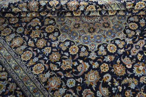 Close-up detail of 1970s Kashan rug from Iran / Persia showing Wool weave