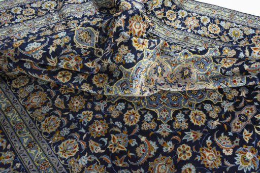 Surface texture of 1970s Kashan rug with natural Wool and intricate pattern