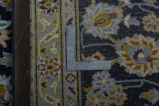 Backside of handmade 1970s Kashan rug showing knot structure and weave density