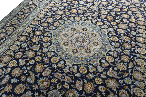 Backside of handmade 1970s Kashan rug showing knot structure and weave density