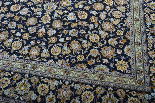 Close-up detail of 1970s Kashan rug from Iran / Persia showing Wool weave