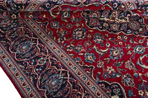 Close-up detail of 2000s Kashan rug from Iran / Persia showing Wool weave