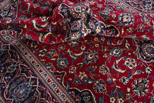 Surface texture of 2000s Kashan rug with natural Wool and intricate pattern