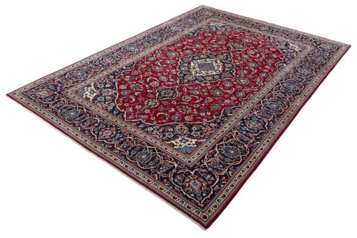 Corner detail of 2000s Kashan rug showing border pattern and Wool pile