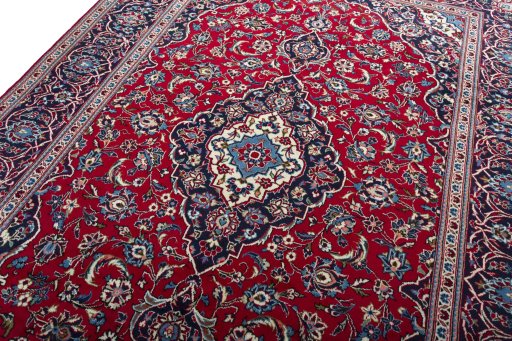 Backside of handmade 2000s Kashan rug showing knot structure and weave density