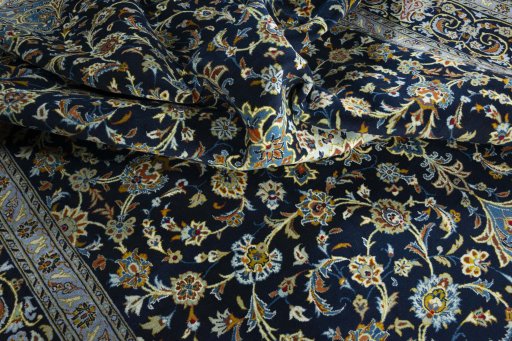 Surface texture of 2000s Kashan rug with natural Wool and intricate pattern