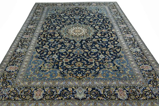 Surface texture of 2000s Kashan rug with natural Wool and intricate pattern
