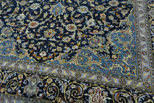 Close-up detail of 2000s Kashan rug from Iran / Persia showing Wool weave