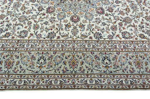 Corner detail of 2000s Kashan rug showing border pattern and Wool pile