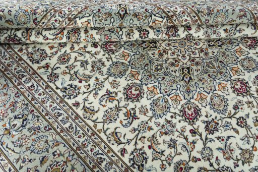 Close-up detail of 2000s Kashan rug from Iran / Persia showing Wool weave