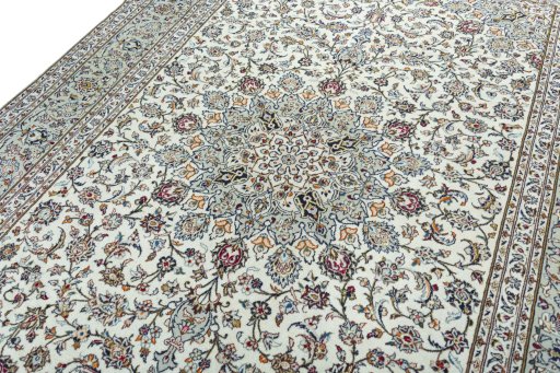 Backside of handmade 2000s Kashan rug showing knot structure and weave density