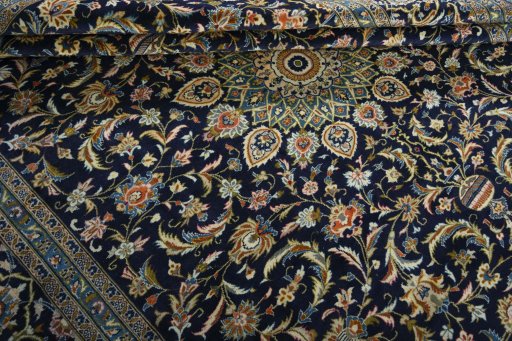Close-up detail of 2000s Kashan rug from Iran / Persia showing Wool weave