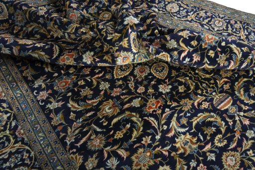 Surface texture of 2000s Kashan rug with natural Wool and intricate pattern