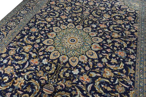 Backside of handmade 2000s Kashan rug showing knot structure and weave density