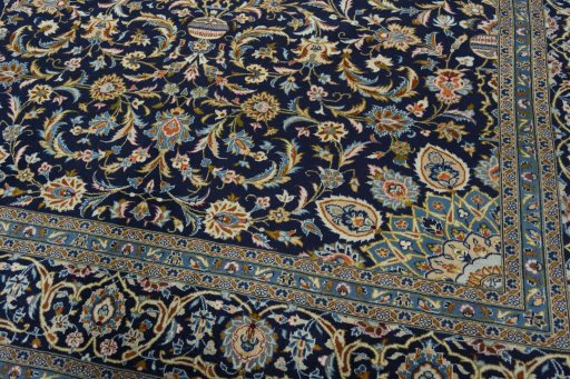 Close-up detail of 2000s Kashan rug from Iran / Persia showing Wool weave