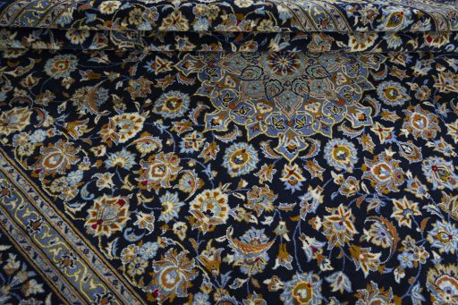 Close-up detail of 2000s Kashan rug from Iran / Persia showing Wool weave