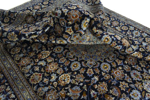 Surface texture of 2000s Kashan rug with natural Wool and intricate pattern
