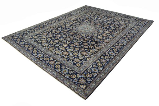 Corner detail of 2000s Kashan rug showing border pattern and Wool pile