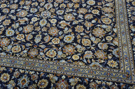 Close-up detail of 2000s Kashan rug from Iran / Persia showing Wool weave