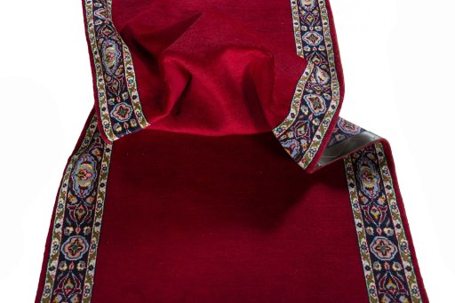 Corner detail of 2000s Kashan rug showing border pattern and Wool pile