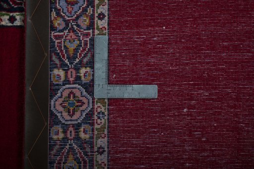 Close-up detail of 2000s Kashan rug from Iran / Persia showing Wool weave