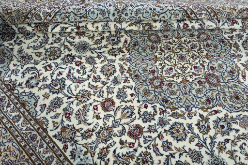 Close-up detail of 2000s Kashan rug from Iran / Persia showing Wool weave