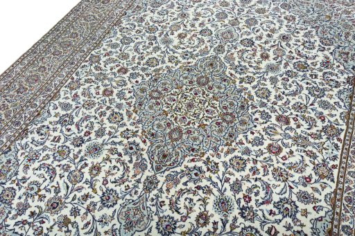 Backside of handmade 2000s Kashan rug showing knot structure and weave density
