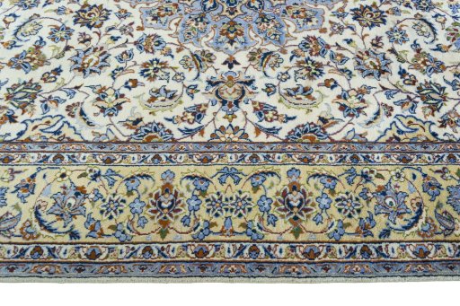 Corner detail of 1970s Kashan rug showing border pattern and Wool pile