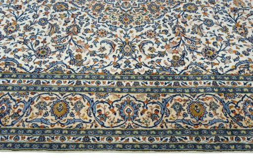 Corner detail of 2000s Kashan rug showing border pattern and Wool pile