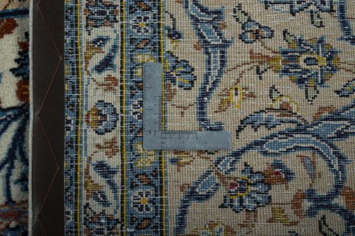 Backside of handmade 2000s Kashan rug showing knot structure and weave density