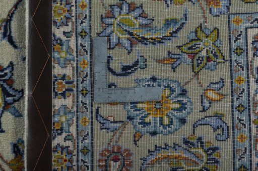Backside of handmade 2000s Kashan rug showing knot structure and weave density