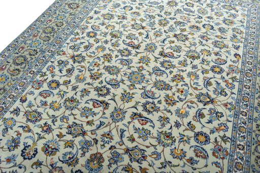 Backside of handmade 2000s Kashan rug showing knot structure and weave density