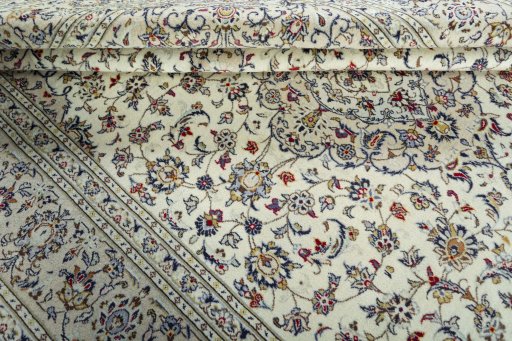 Close-up detail of 2000s Kashan rug from Iran / Persia showing Wool weave