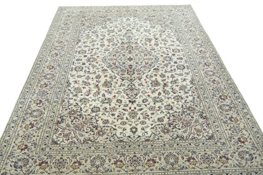 Surface texture of 2000s Kashan rug with natural Wool and intricate pattern