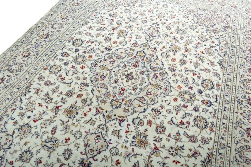 Backside of handmade 2000s Kashan rug showing knot structure and weave density