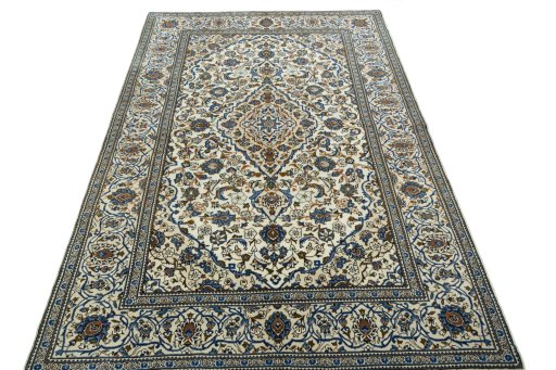 Surface texture of 2000s Kashan rug with natural Wool and intricate pattern
