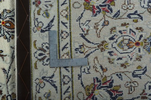 Backside of handmade 2000s Kashan rug showing knot structure and weave density