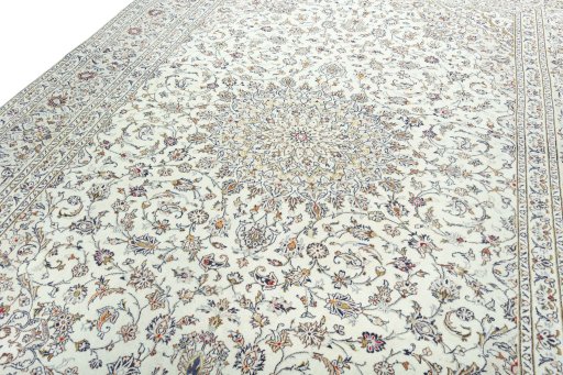 Backside of handmade 2000s Kashan rug showing knot structure and weave density