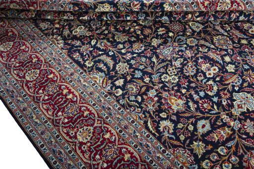 Close-up detail of 2000s Kashan rug from Iran / Persia showing Wool weave