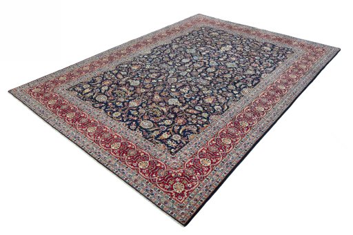 Corner detail of 2000s Kashan rug showing border pattern and Wool pile