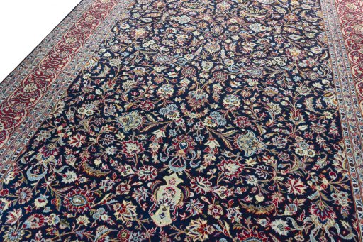 Backside of handmade 2000s Kashan rug showing knot structure and weave density