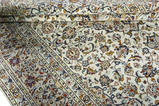 Close-up detail of 2000s Kashan rug from Iran / Persia showing Wool weave